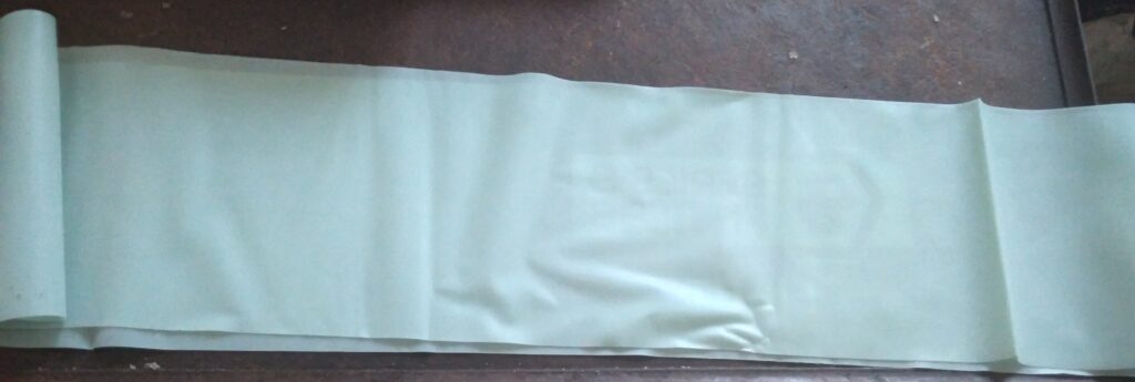 Blue resistance band resting on a table.